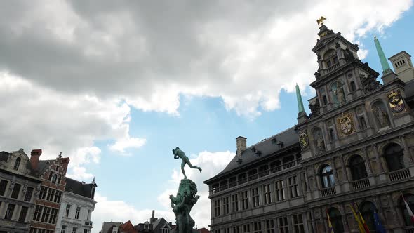Dark clouds above the city of Antwerp, Belgium. Grote Markt with Town Hall and Brabo Fountain - Time alt