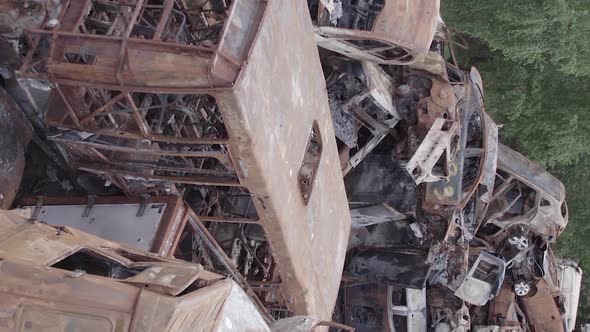 Vertical Video Irpin Ukraine  Burnt and Destroyed Cars alt