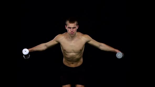 Man Lifts Weights in the Tilt Position. Slow Motion. Black alt