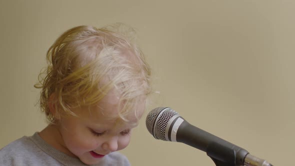 Cute Little Girl Sing Song Into Microphone, Funny Toddler Enjoing Broadcasting