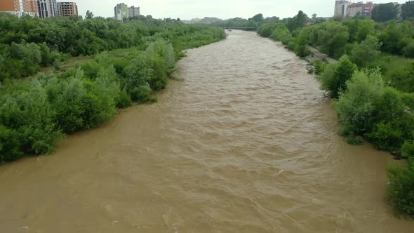 Aerial Drone View. Rriver Water Big and Dirty After Heavy Rain. Wide View alt