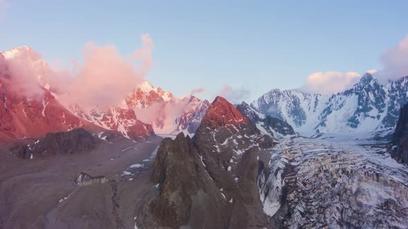 Tian Shan Snow-Capped Mountains at Sunset. Aerial Hyper Lapse alt