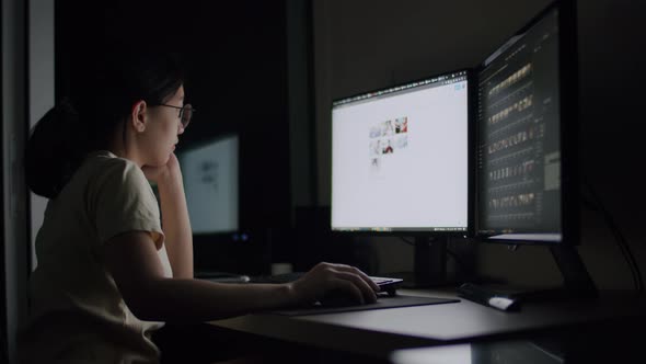 Candid of Asian female work late night stress out a problem on a computer at the home office.