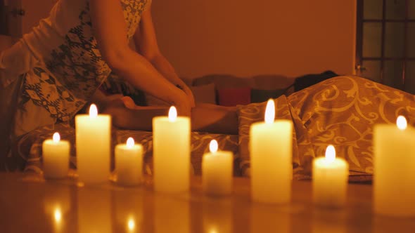 Young Ecuadorian Mixed Race Woman Getting Leg and Feet Massage with Oil in Resort Spa Salon alt