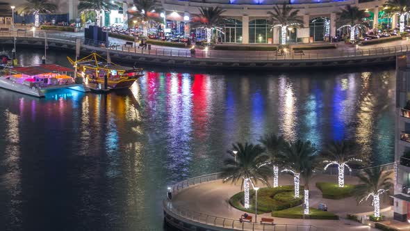 Luxury Dubai Marina Canal with Passing Boats and Promenade Night Timelapse Dubai United Arab alt