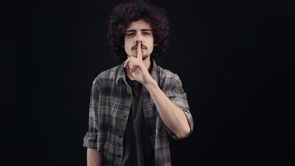 Charismatic Mysterious Young Man He Puts His Index Finger to His Lips Keeping the Secret and Throws alt