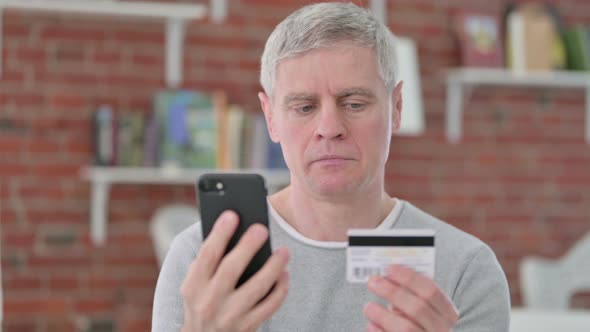 Senior Old Man Doing Successful Payment on Smartphone  alt
