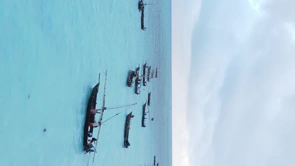 Tanzania Vertical Video  Boat Boats in the Ocean Near the Coast of Zanzibar Aerial View alt