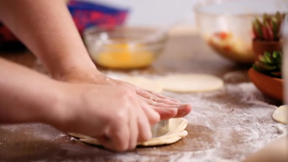 Step by step. Rolling dough for home made empanadas. alt