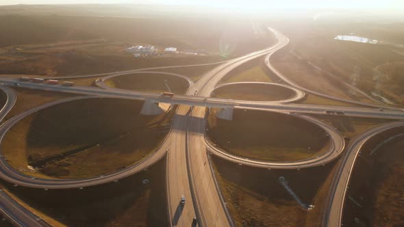 Aerial View. Highway and Overpass with Cars and Trucks. The Road Junction Is a Two-tier Road alt