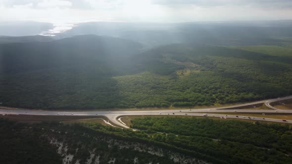 Highway in a Deciduous Forest Aerial View
