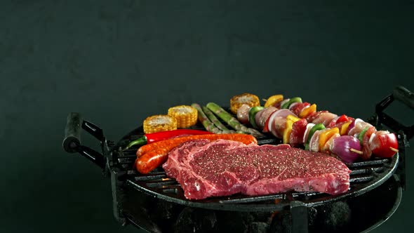 Super Slow Motion Shot of Fresh Beef Meat Falling on Grill at 1000 Fps alt