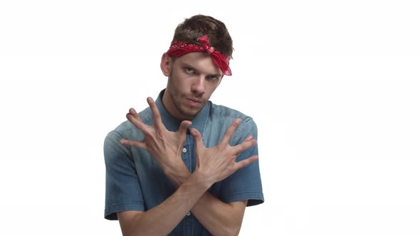 Video of Handsome Hipster with Beard Wearing Red Headband and Denim Shirt Showing Hiphop Sign West
