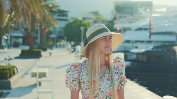 Caucasian Woman in Sun Hat Thinking About Something