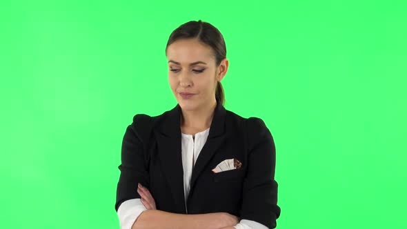 Lovely Girl Is Very Offended and Looks Away. Green Screen alt