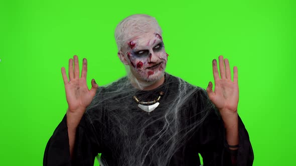 Creepy Halloween Zombie Man Smiling Friendly Waving Hands Gesturing Hello or Goodbye Welcoming alt