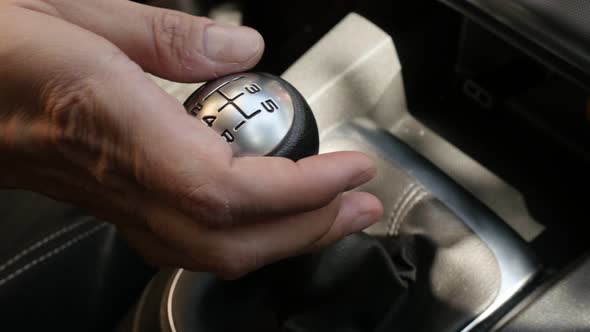 Changing gears manually with car shift stick 4K video alt