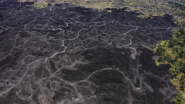 Roads on a Solidified Lava Field Near Volcano Batur in Bali, Indonesia. Aerial View  alt