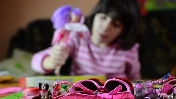 Little Girl Playing With Pink Doll 1