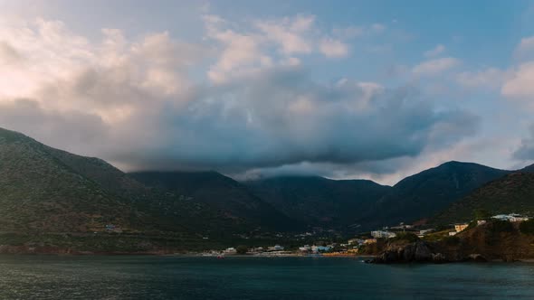 Time lapse of Clouds moving above Village and Mountains in Greece, Beautiful Landscape  alt
