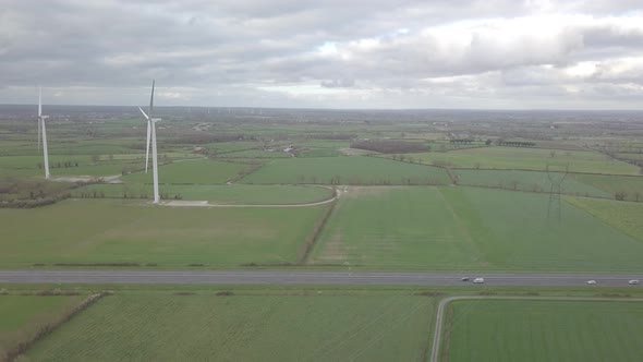 Wind Turbine on a highway - 4K