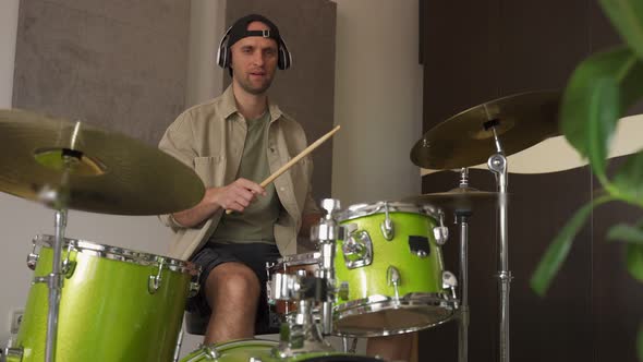 Man Records Drum Lesson Demonstrating Playing Drums alt