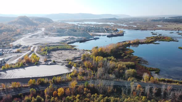 Aerial view of the industrial zone for the extraction and loading of limestone and sand. alt