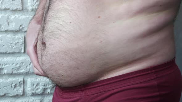 Man Demonstrates Overweight, Overweight Man's Belly, Obesity, Man Showing Fat Belly Close Up