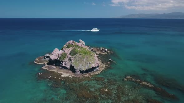Pleasure Boat Is Moving in Ocean Near Resort, Aerial View in Summer