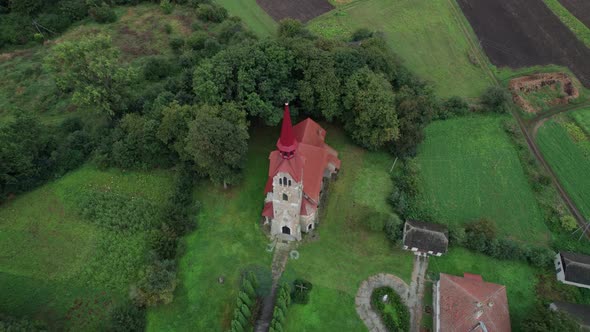 Fly Over the Roman Catholic Church in a Countryside alt