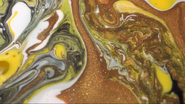 Yellow, white, black and gold color ink mix. Texture of liquid marble alt