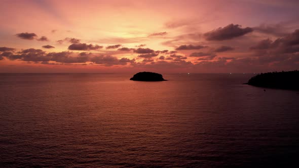 Orange Sunset with a View of the Sea and Island alt