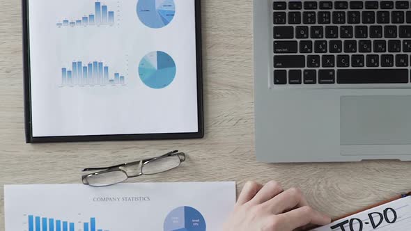 Entrepreneur Completing to Do List in Notebook, Planning Startup Company, Scheme alt