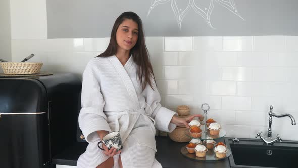 Beautiful Bride Brunette Eat Cake in a Bathrobe alt