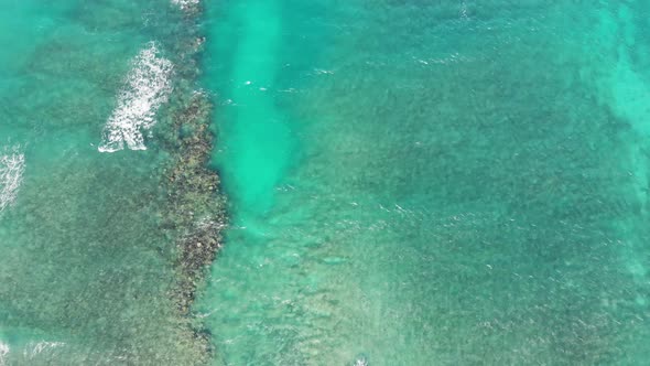 Flight over the sea coast into the deep blue sea