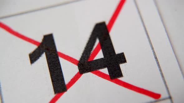 The 14St Number in the Calendar is Crossed Out with a Red Cross in a Macro on a White Sheet alt