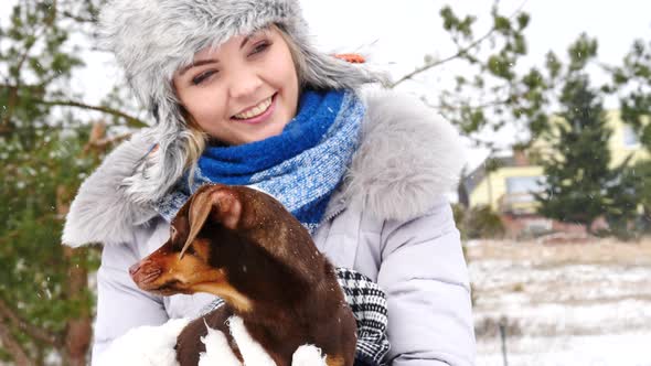 Woman with Dogs Outdoors in Winter alt