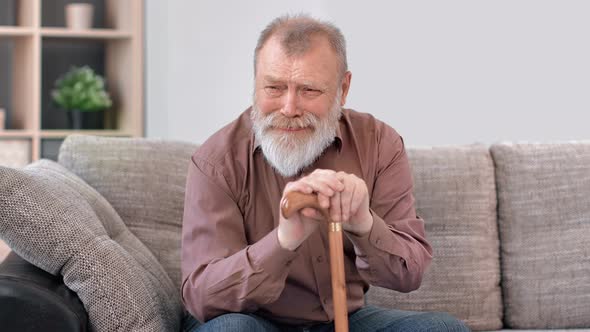 Closeup Wrinkled Face of Crying Disabled Grandfather Suffering Stress Depression at Retirement House alt