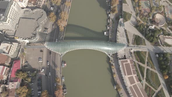 Aerial view of Tbilisi city central park and Bridge of Peace alt