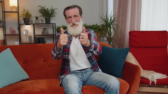 Senior Man Showing Thumbs Up Nodding in Approval Successful Good Work Satisfaction Results at Home alt