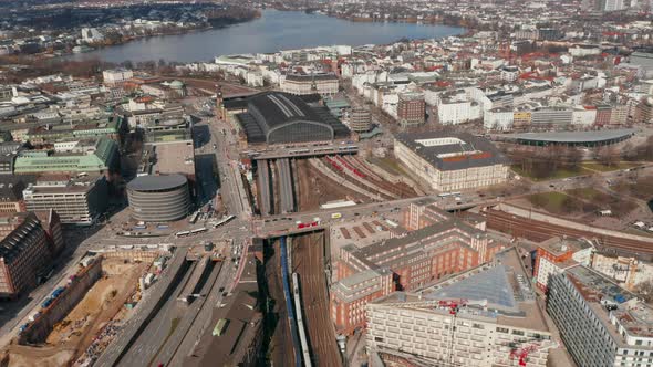 Aerial View of Two Trains Arriving Into Hamburg Main Train Station Under Road Overpass alt