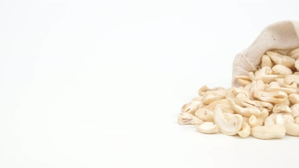 Dolly shot Cashew nuts on white background, Close up.