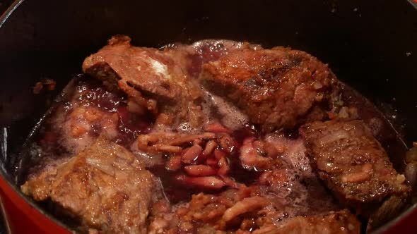 Preparation of traditional burgundy beef with red Burgundy wine alt