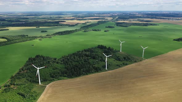 Windmills in Summer in a Green Field alt