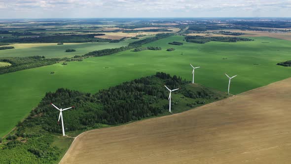 Windmills in Summer in a Green Field