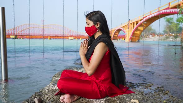 Indian Woman Wearing Coronavirus Protection Face Mask Holy River Ganges Flowing in Background