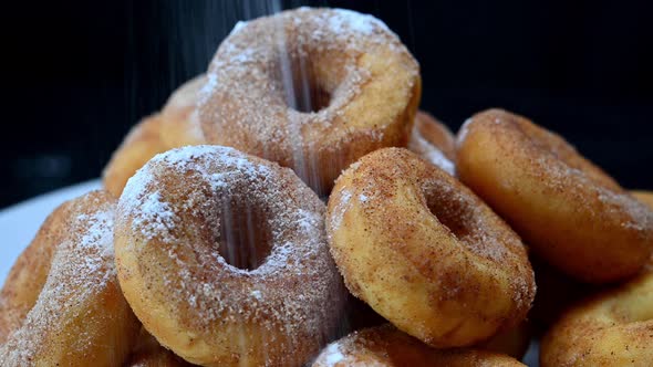 Donuts Being Sprinkled with Sugar