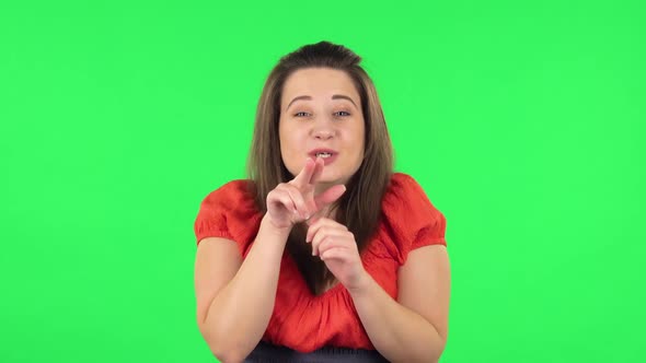 Portrait of Cute Girl Looking with Tenderness with Folded Arms in Front of Her. Green Screen alt