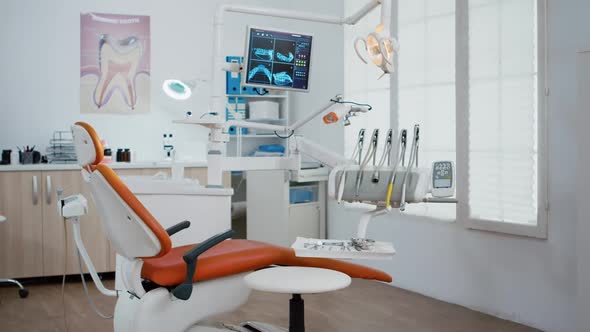 Interior of Modern Equipment Oral Office with Teeth x Ray on Monitors alt
