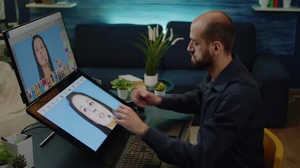 Media Artist Working on Touch Screen Monitor to Edit Pictures alt